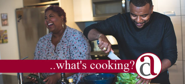 couple working in kitchen talking about equity release