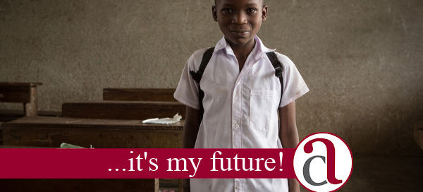 boy being helped by Socially Responsible Invents in school